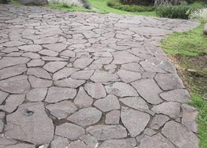 Stone pathway with grass on either side